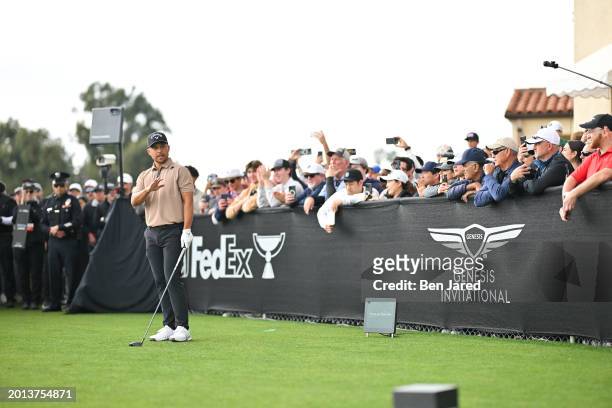 Xander Schauffele waves to fans on the first tee box during the final round of The Genesis Invitational at Riviera Country Club on February 18, 2024...