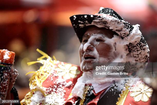 Man with foam on his face dances during the iconic parade of 'Entierro del Pepino' at General Cemetery of La Paz on February 18, 2024 in La Paz,...