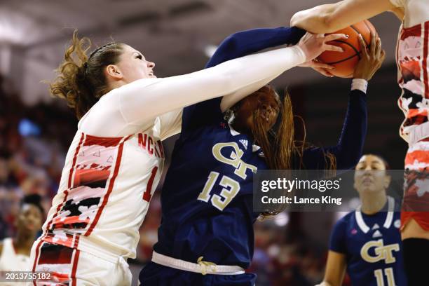 River Baldwin of the NC State Wolfpack battles for the ball against Kayla Blackshear of the Georgia Tech Yellow Jackets during overtime of the game...