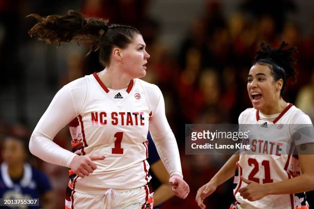 River Baldwin reacts following her basket with teammate Madison Hayes of the NC State Wolfpack during overtime of the game against the Georgia Tech...