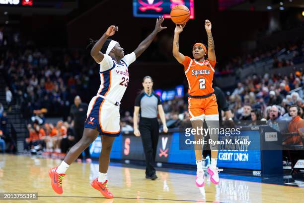 Dyaisha Fair of the Syracuse Orange shoots over Alexia Smith of the Virginia Cavaliers in the first half during a game at John Paul Jones Arena on...