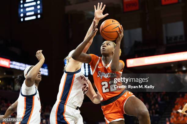 Kyra Wood of the Syracuse Orange shoots past Sam Brunelle of the Virginia Cavaliers in the first half during a game at John Paul Jones Arena on...