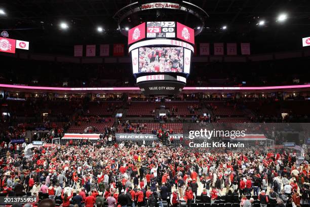 Fans celebrate on the court after the Ohio State Buckeyes upset the Purdue Boilermakers at Value City Arena on February 18, 2024 in Columbus, Ohio....