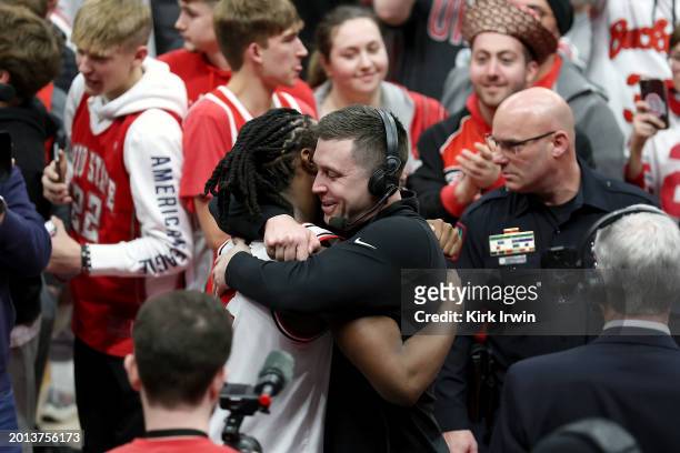 Interim head coach Jake Diebler of the Ohio State Buckeyes hugs Bruce Thornton after upsetting the Purdue Boilermakers at Value City Arena on...