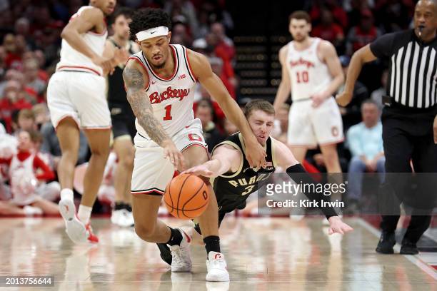 Braden Smith of the Purdue Boilermakers knocks the ball out of the hands of Roddy Gayle Jr. #1 of the Ohio State Buckeyes during the second half of...