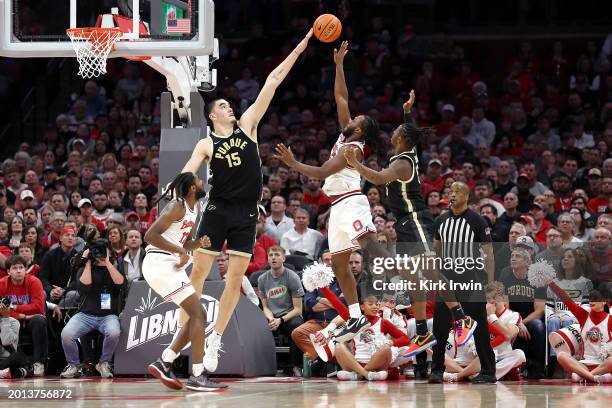 Zach Edey of the Purdue Boilermakers blocks a shot by Bruce Thornton of the Ohio State Buckeyes during the second half of the game at Value City...