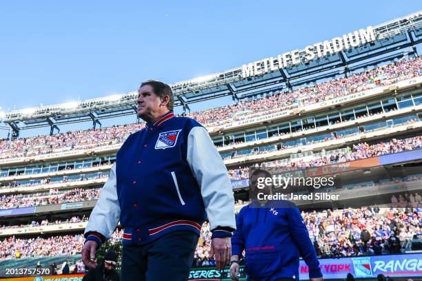 New York Rangers head coach Peter Laviolette enters the arena prior to the game against the New York Islanders during the 2024 Navy Federal Credit...