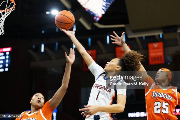 Paris Clark of the Virginia Cavaliers shoots between Saniaa Wilson and Alaina Rice of the Syracuse Orange in the second half during a game at John...