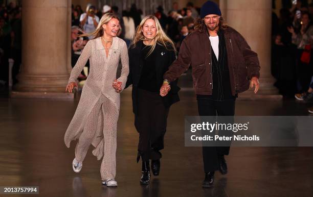 Designer Susanne Holzweiler, creative director Maria Skappel Holzweiler and designer Andreas Holzweiler walk the runway at the end of the Holzweiler...