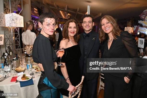 Emma Corrin, Barbara Broccoli, Rami Malek and Veronika Kwan Vandenberg attend the EE BAFTA Film Awards 2024 Dinner at The Royal Festival Hall on...