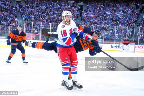 Matt Martin of the New York Islanders gets tripped up against Vincent Trocheck of the New York Rangers during the first period during the 2024 Navy...