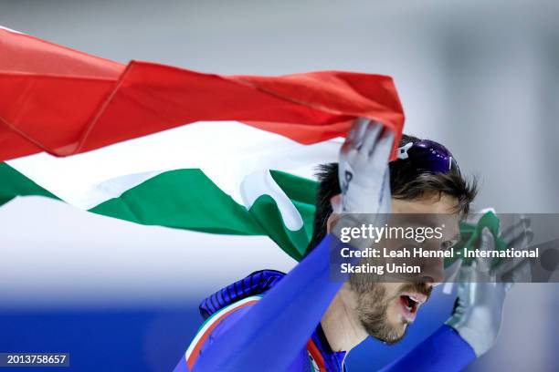 Davide Ghiotto of Italy skates a lap with the Italian flag after the Men's 10000m on day 4 of the ISU World Single Distances Speed Skating...