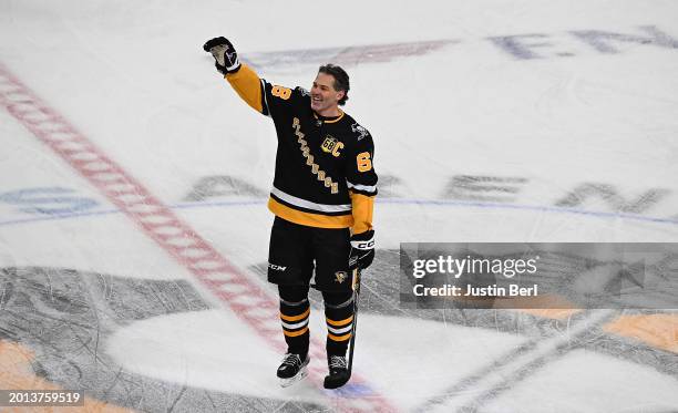Jaromir Jagr waves to the crowd after he skated in warmups following his jersey retirement ceremony before the game between the Pittsburgh Penguins...