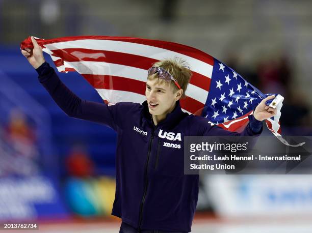 Jordan Stolz of the United skates with a flag in the Men's 1500m during day 4 of the ISU World Single Distances Speed Skating Championships at the...