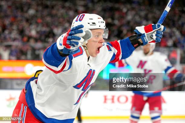 Artemi Panarin of the New York Rangers celebrates after scoring the game-winning goal against the New York Islanders in overtime during the 2024 Navy...