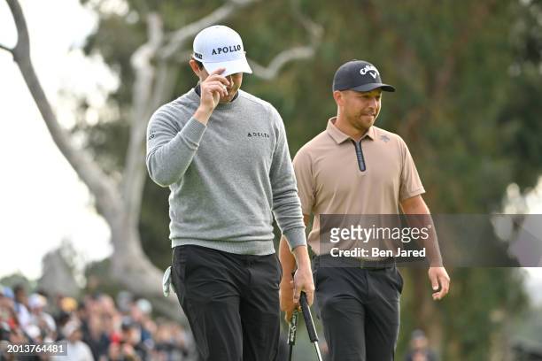 Patrick Cantlay tips his hat on the 18th green during the final round of The Genesis Invitational at Riviera Country Club on February 18, 2024 in...