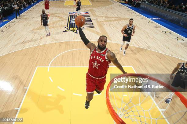 LeBron James of the Western Conference dunks the ball during the game against the Eastern Conference during the NBA All-Star Game as part of NBA...