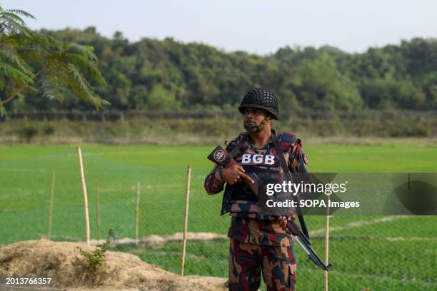 Member of the Border Guard Bangladesh stands on guard in the Naikhongchori area near the Bangladesh-Myanmar border in the Bandarban district of...
