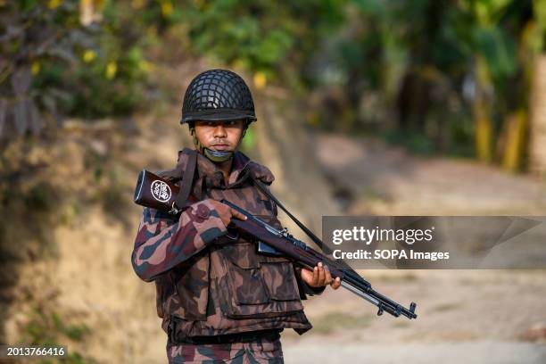 Member of the Border Guard Bangladesh stands on guard in the Naikhongchori area near the Bangladesh-Myanmar border in the Bandarban district of...