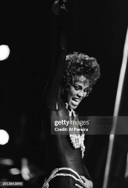 Whitney Houston performs at Madison Square Garden on her "I'm Your Baby Tonight World Tour" on July 23, 1991 in New York City.