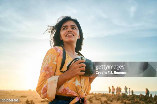 woman with photo camera in punta gallinas, la guajira, colombia - photographer stock pictures, royalty-free photos & images
