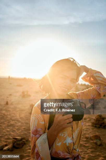 woman with photo camera in punta gallinas, la guajira, colombia - gallinas stock pictures, royalty-free photos & images