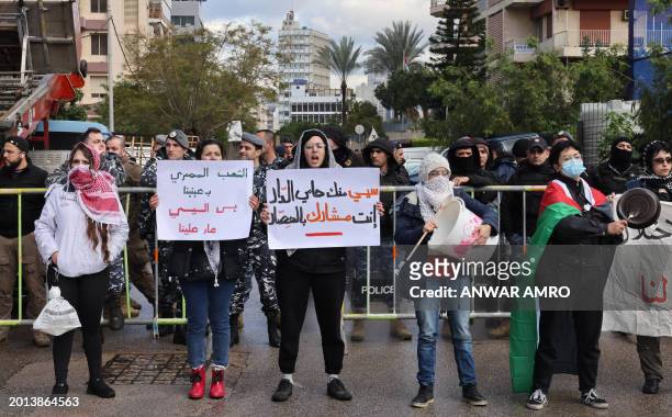 Activists block the road leading to the Egyptian embassy in the Lebanese capital Beirut in protest against the closure of the Rafah crossing between...