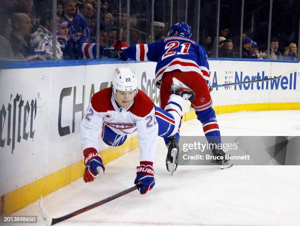 Cole Caufield of the Montreal Canadiens is tripped up by Barclay Goodrow of the New York Rangers during the first period at Madison Square Garden on...