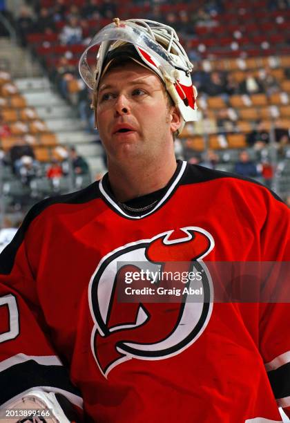 Martin Brodeur of the New Jersey Devils skates against the Toronto Maple Leafs during NHL game action on January 10, 2004 at Air Canada Centre in...