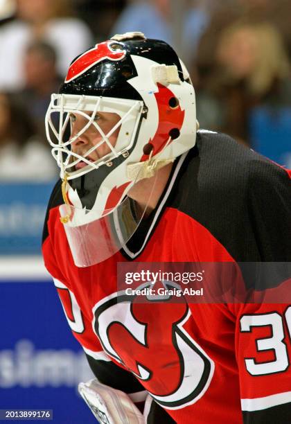 Martin Brodeur of the New Jersey Devils skates against the Toronto Maple Leafs during NHL game action on January 10, 2004 at Air Canada Centre in...