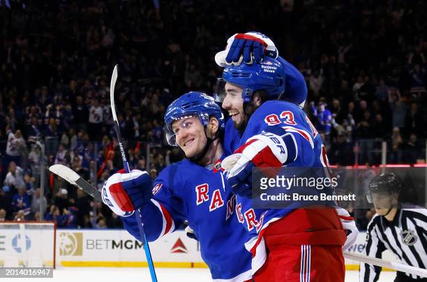 Mika Zibanejad of the New York Rangers celebrates his shorthanded goal against the Montreal Canadiens at 14:43 of the second period and is joined by...