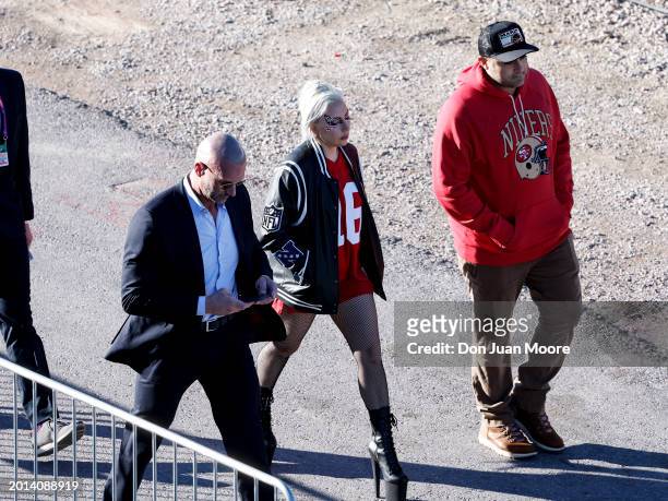 Singer, Songwriter, and actress Lady Gaga and her boyfriend, CEO of the Parker Group Michael Polansky, right, arrive to Allegiant Stadium showing...