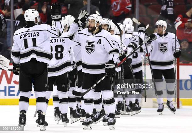 Anze Kopitar and Drew Doughty of the Los Angeles Kings celebrate the win over the New Jersey Devils at Prudential Center on February 15, 2024 in...