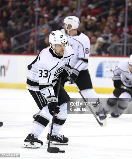 Viktor Arvidsson of the Los Angeles Kings takes the puck during the first period against the New Jersey Devils at Prudential Center on February 15,...