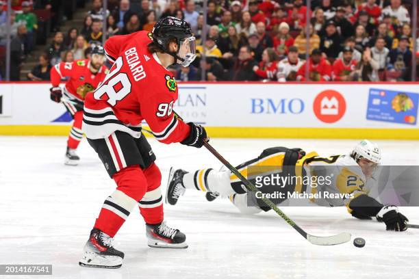 Connor Bedard of the Chicago Blackhawks assist a goal by Philipp Kurashev against the Pittsburgh Penguins during the second period at the United...