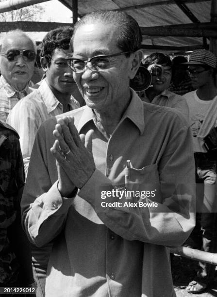 Son Sann, leader of the anti-communist Khmer People's National Liberation Front and former Prime Minister of Cambodia , greets supporters at the...