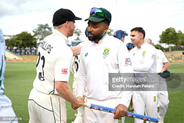 Glenn Phillips of the New Zealand Black Caps shakes hands with Dane Piedt of South Africa after winning the series during day four of the Men's...