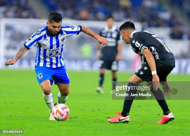 Jesus Corona of Monterrey fights for the ball with Erik Gonzalez of Comunicaciones during the second leg of the CONCACAF Champions League game at...