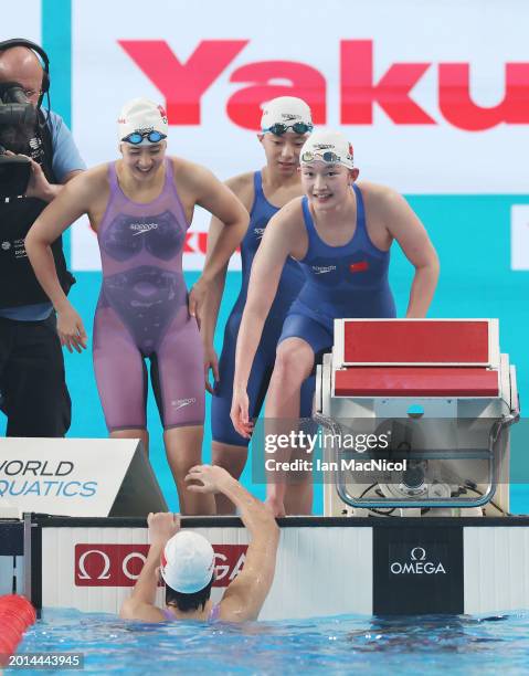 Yanhan Ai, Zhenqi Gong, Bingjie Li and Peiqi Yang of Team People's Republic of China react as they win gold in the Women's 4x200m Freestyle Final on...