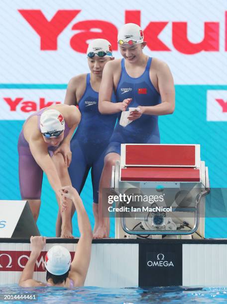 Yanhan Ai, Zhenqi Gong, Bingjie Li and Peiqi Yang of Team People's Republic of China react as they win gold in the Women's 4x200m Freestyle Final on...