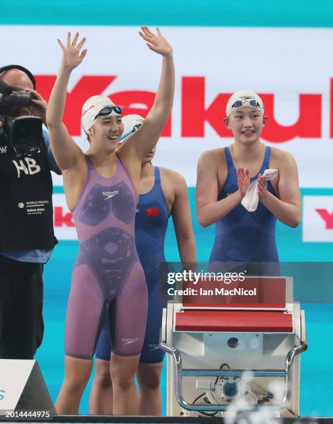 Yanhan Ai, Zhenqi Gong, Bingjie Li and Peiqi Yang of Team People's Republic of China react as they win gold in the Women's 4x200m Freestyle Final on...