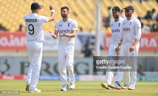 England bowler Mark Wood is congratulated by James Anderson after he had taken the wicket of India batsman Jasprit Bumrah during day two of the 3rd...