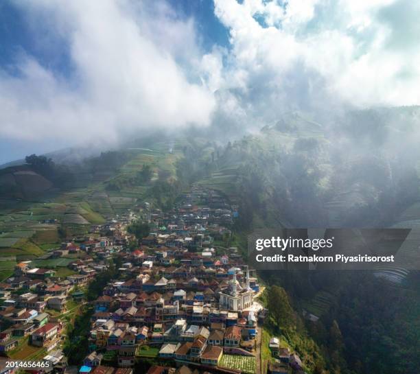 aerial shot of butuh village, magelang, indonesia also known as nepal van java in foggy morning - nepal drone stock pictures, royalty-free photos & images