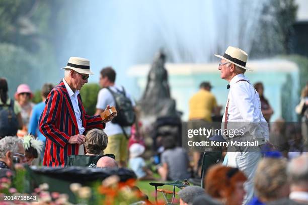 People in Art Deco costume enjoy a picnic tea on the beach on February 16, 2024 in Napier, New Zealand. The City of Napier celebrated the first...