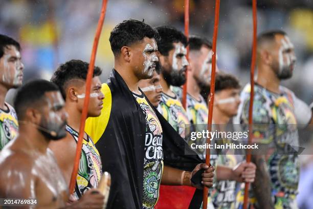 Latrell Mitchell of the Indigenous All-Stars stands with his team as part of the pre-game ceremony during the NRL All-Stars match between Men's...