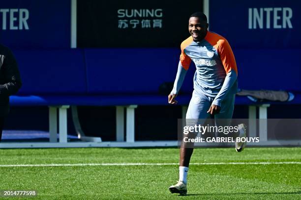 Inter Milan's French forward Marcus Thuram attends a training session with teammates on the eve of the UEFA Champions League last 16 first leg...