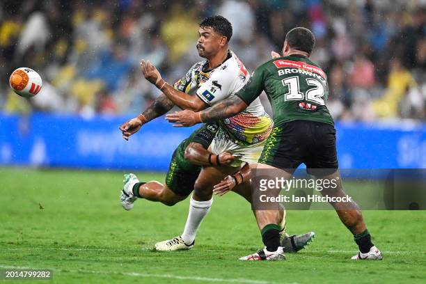Latrell Mitchell of the Indigenous All-Stars passes as he is tackled during the NRL All-Stars match between Men's Australia Indigenous All Stars and...