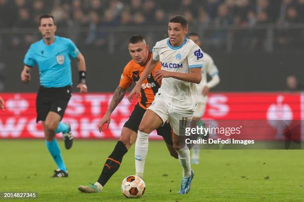 Amine Harit of Olympique Marseille and Oleksandr Zubkov of Shakhtar Donetsk battle for the ball during the UEFA Europa League 2023/24 Knockout Round...