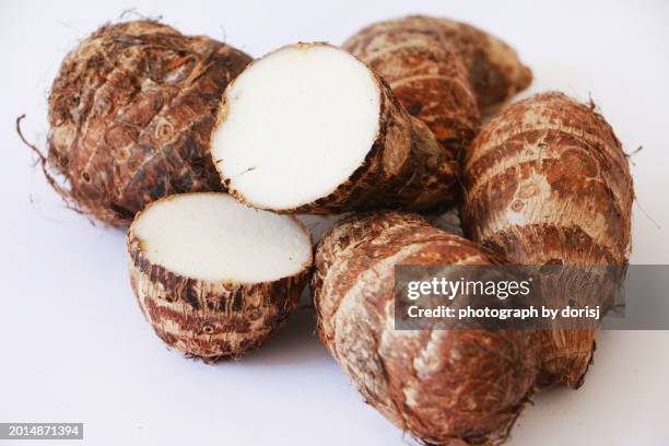 taro root or yam - yam plant stock pictures, royalty-free photos & images