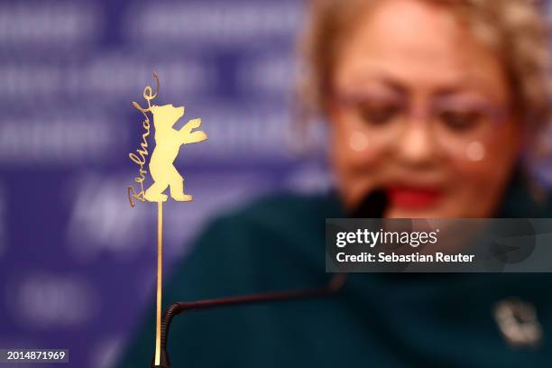 The Berlinale logo is on display in front of Lily Farhadpour speaking at the "Keyke mahboobe man" press conference during the 74th Berlinale...